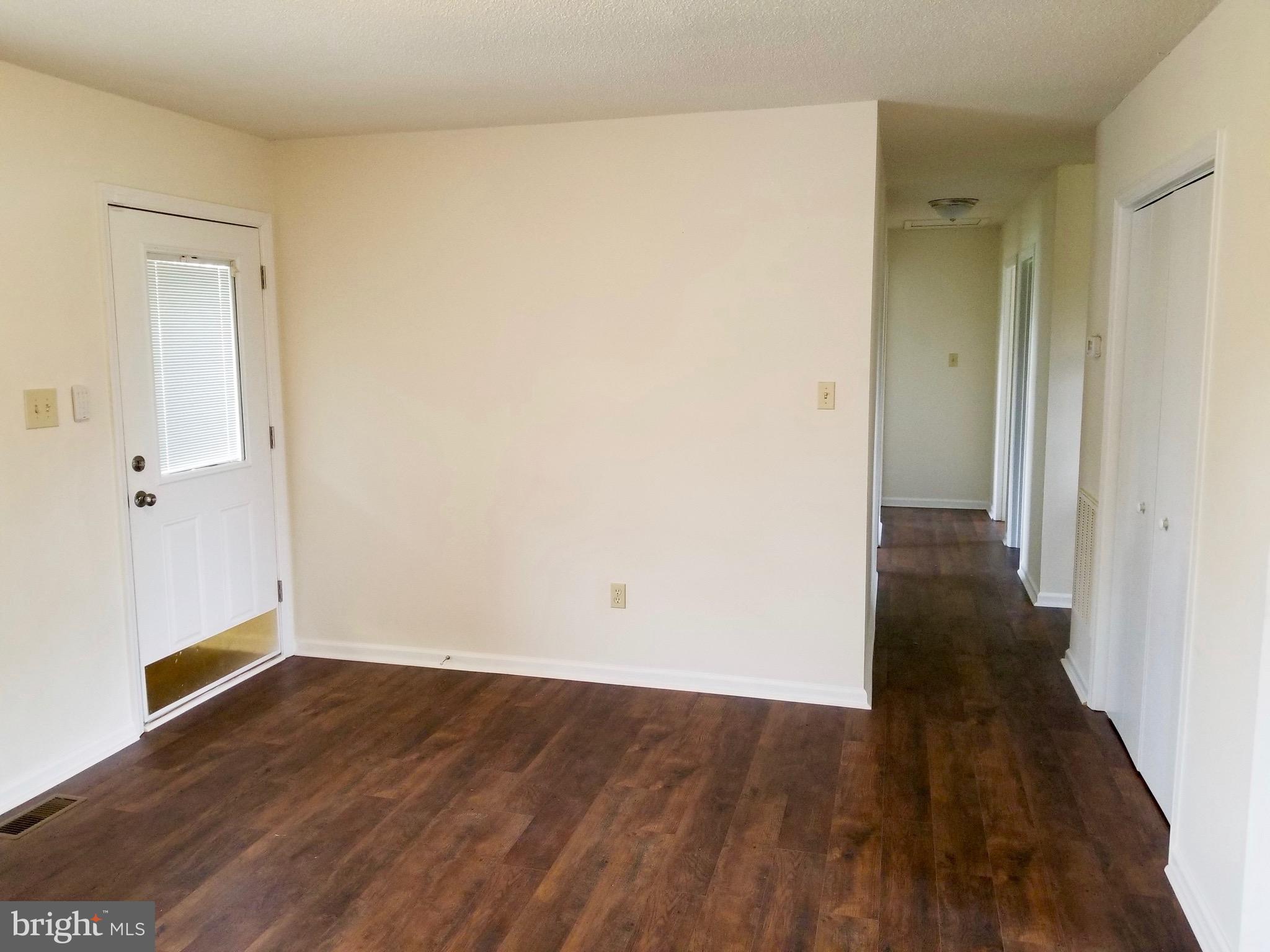 135 Truman Road Inwood, WV 25428 - Photo 4 of 30 wooden floor in a empty room