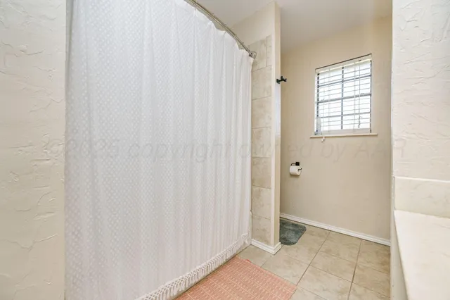 a view of an empty room with windows