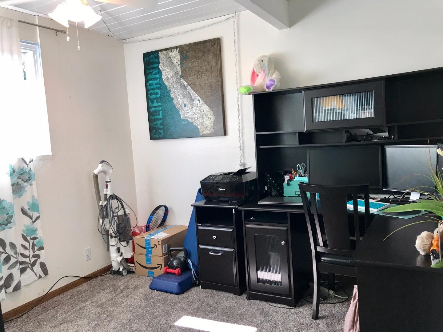6087 Bollinger Road Cupertino, CA 95014 - Photo 16 of 20 a living room with furniture a flat screen tv and a fireplace