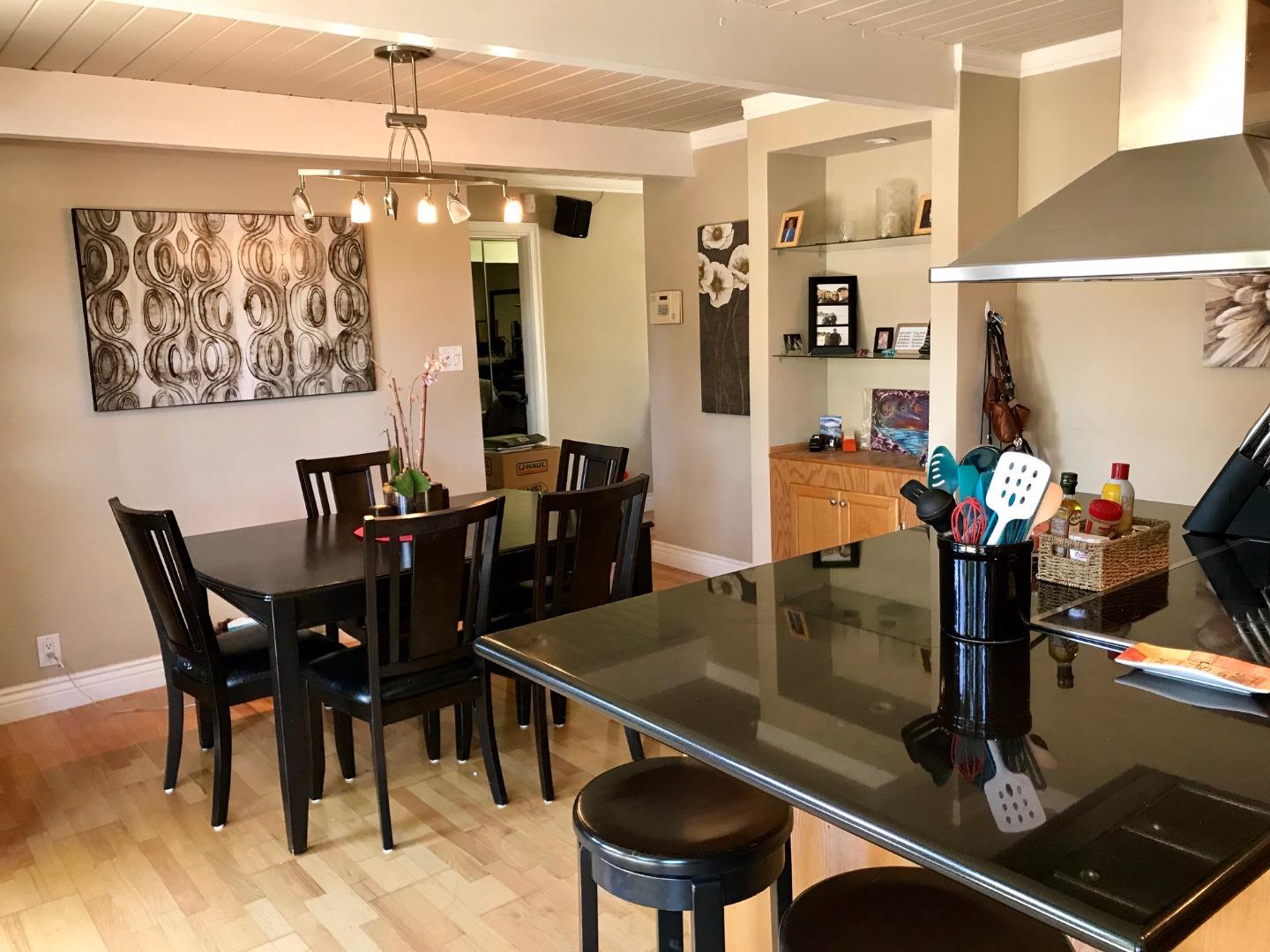 6087 Bollinger Road Cupertino, CA 95014 - Photo 5 of 20 a dining room with furniture and chandelier