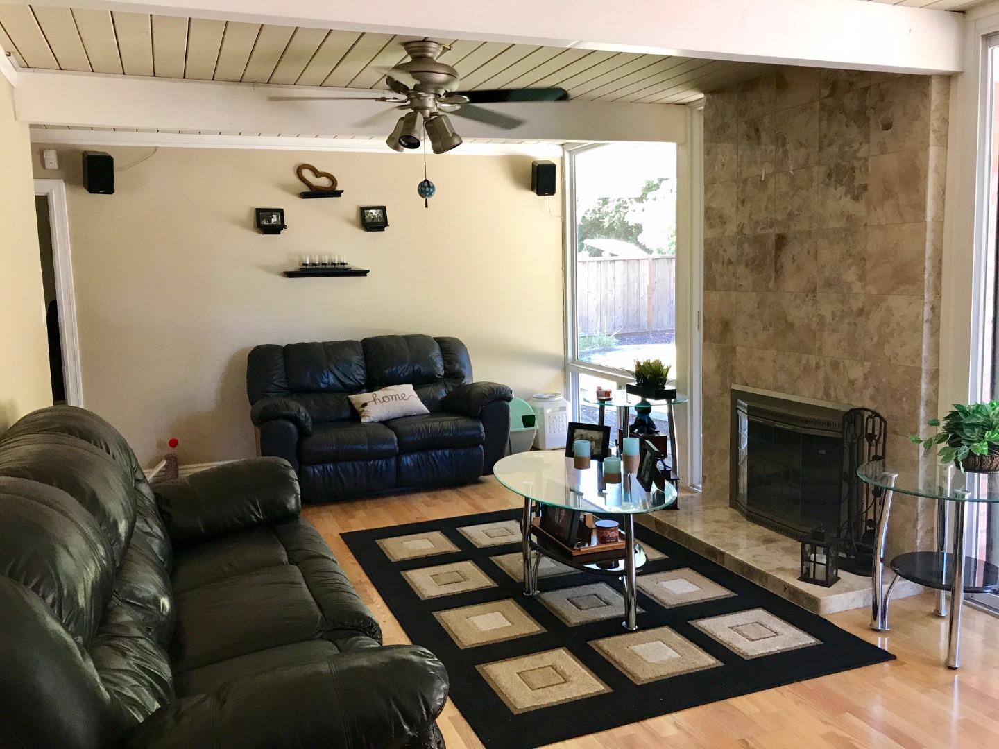 6087 Bollinger Road Cupertino, CA 95014 - Photo 6 of 20 a living room with furniture and a fireplace