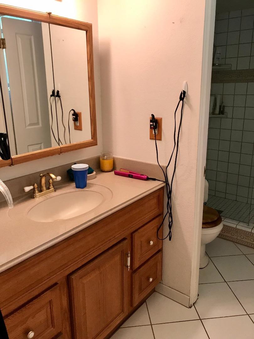 6087 Bollinger Road Cupertino, CA 95014 - Photo 10 of 20 a bathroom with a sink and a mirror