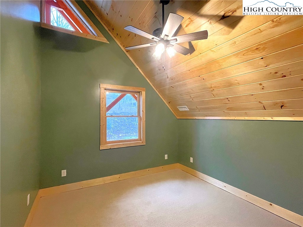 111 Village Cluster Road Beech Mountain, NC 28604 - Photo 18 of 27 a view of a room with a fan and a window