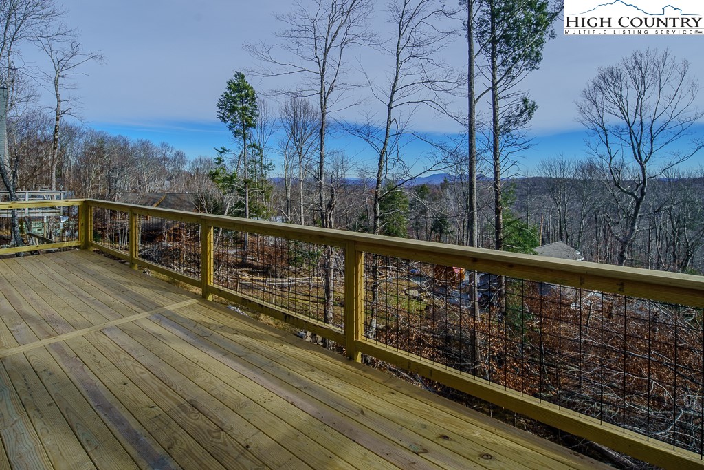 111 Village Cluster Road Beech Mountain, NC 28604 - Photo 20 of 27 a view of balcony with wooden floor and fence