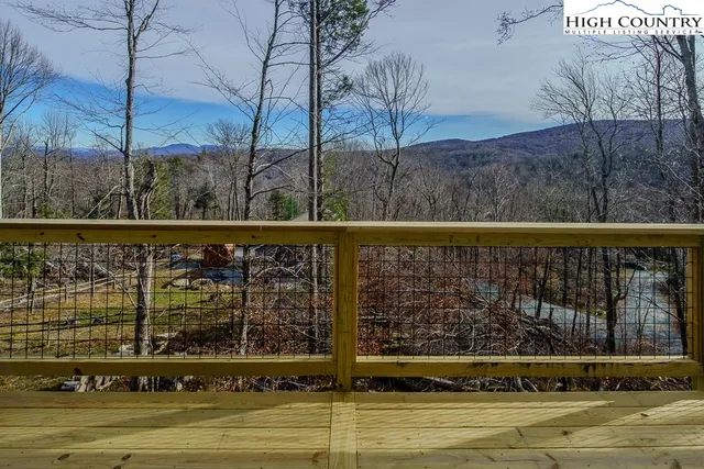 a view of a patio with a table and chairs