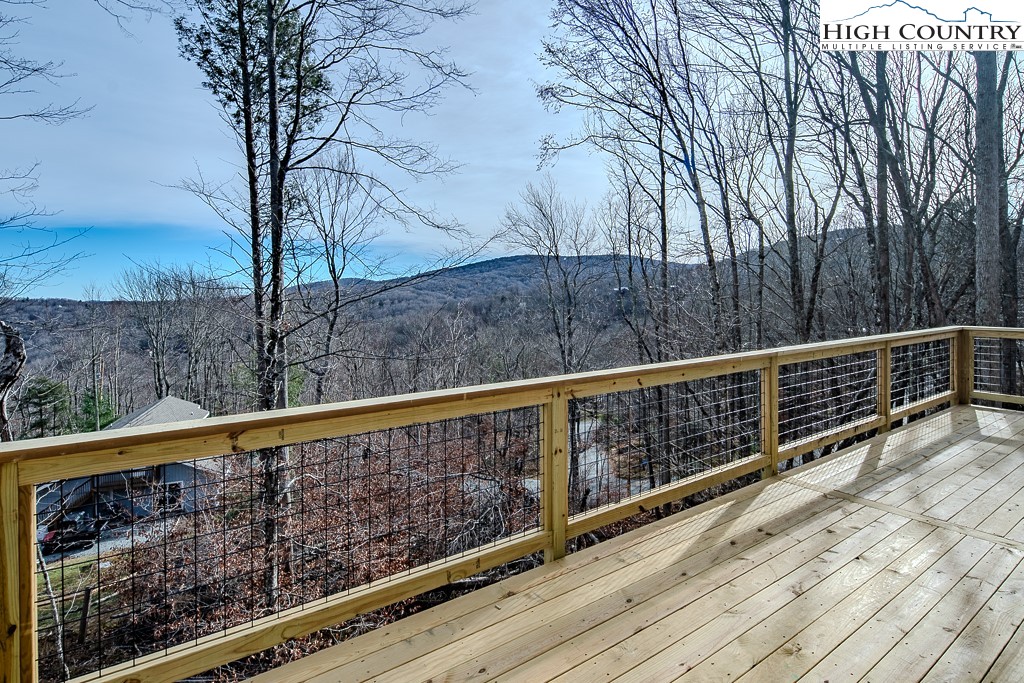 111 Village Cluster Road Beech Mountain, NC 28604 - Photo 22 of 27 a view of balcony with wooden floor and fence
