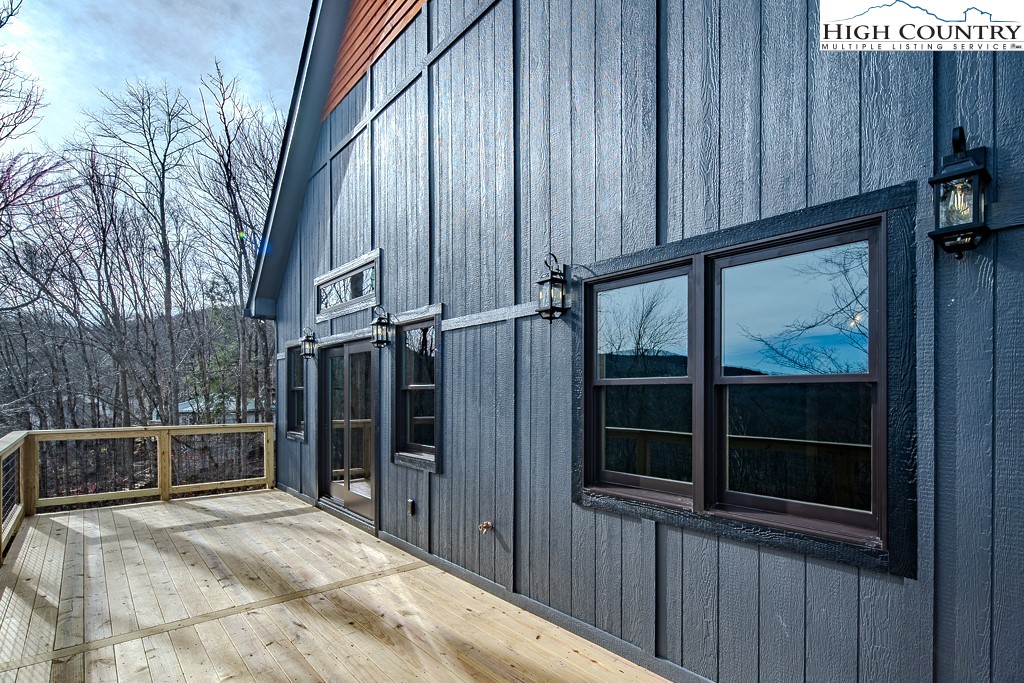 111 Village Cluster Road Beech Mountain, NC 28604 - Photo 23 of 27 a view of a house with a backyard