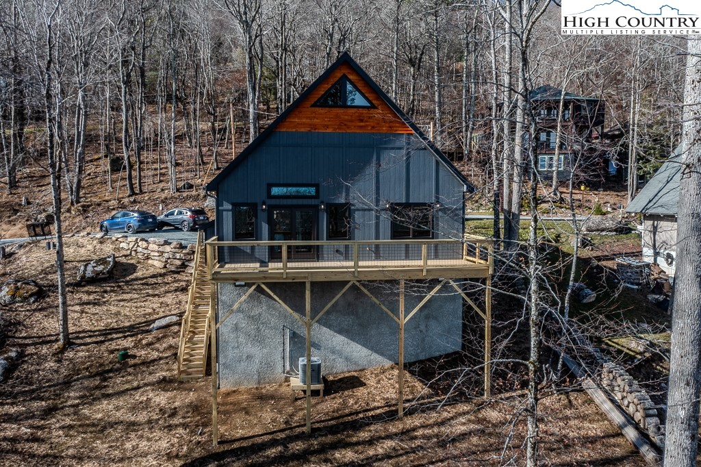 111 Village Cluster Road Beech Mountain, NC 28604 - Photo 27 of 27 a front view of a house with parking space