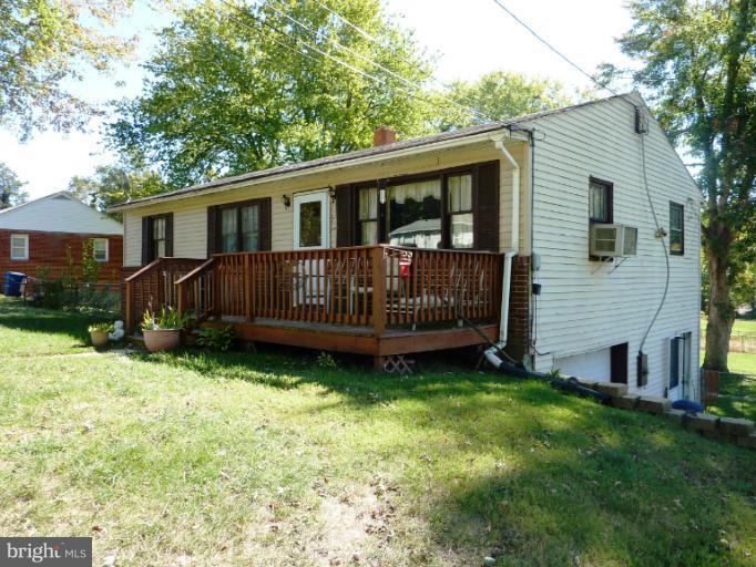 4117 Anderson Road Triangle, VA 22172 - Photo 1 of 30 a view of a house with a yard and deck