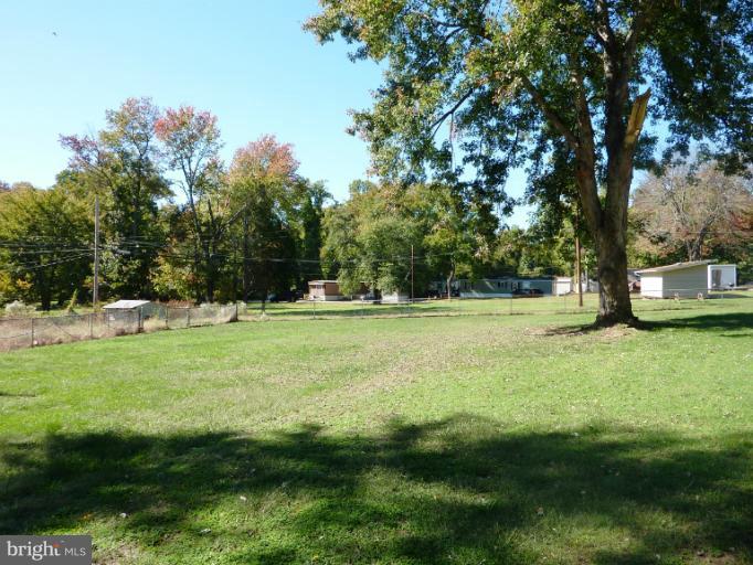 4117 Anderson Road Triangle, VA 22172 - Photo 13 of 30 a view of outdoor space with green field and trees