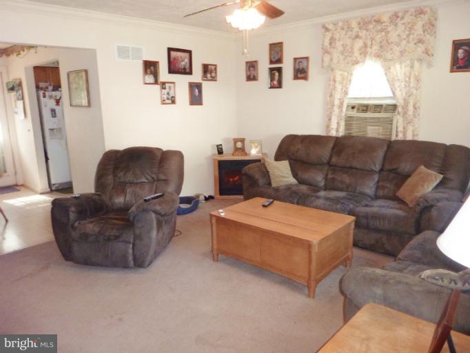 4117 Anderson Road Triangle, VA 22172 - Photo 17 of 30 a living room with furniture and a window