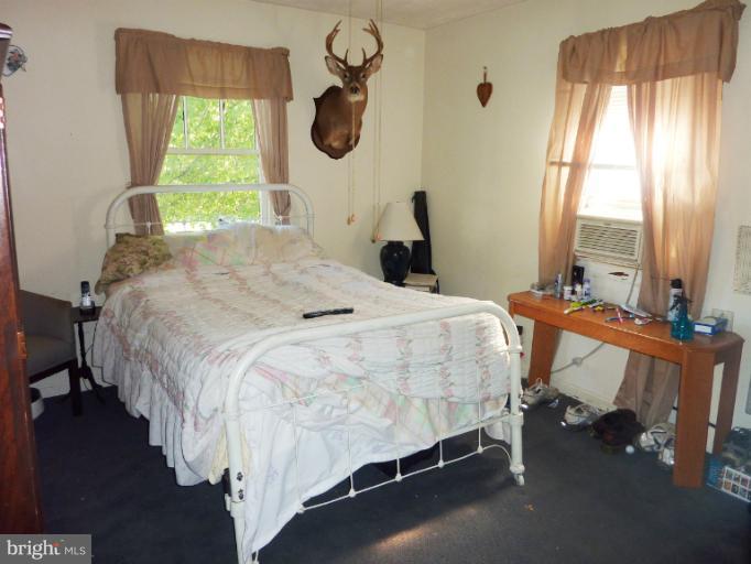 4117 Anderson Road Triangle, VA 22172 - Photo 30 of 30 a bedroom with a bed chair and a large window