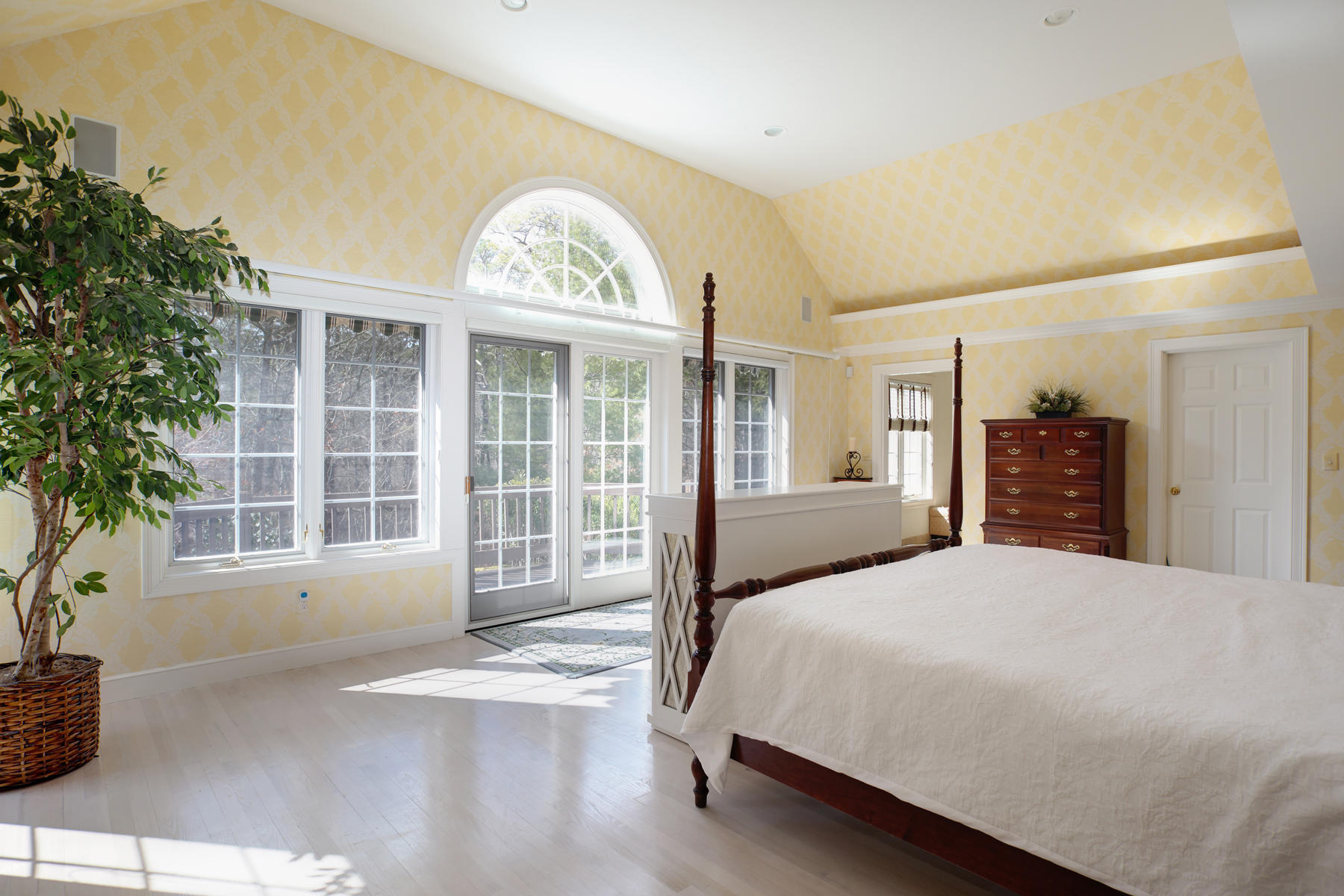 81 Farm Valley Road Osterville, MA 02655 - Photo 14 of 35 a bedroom with a large bed and a large window