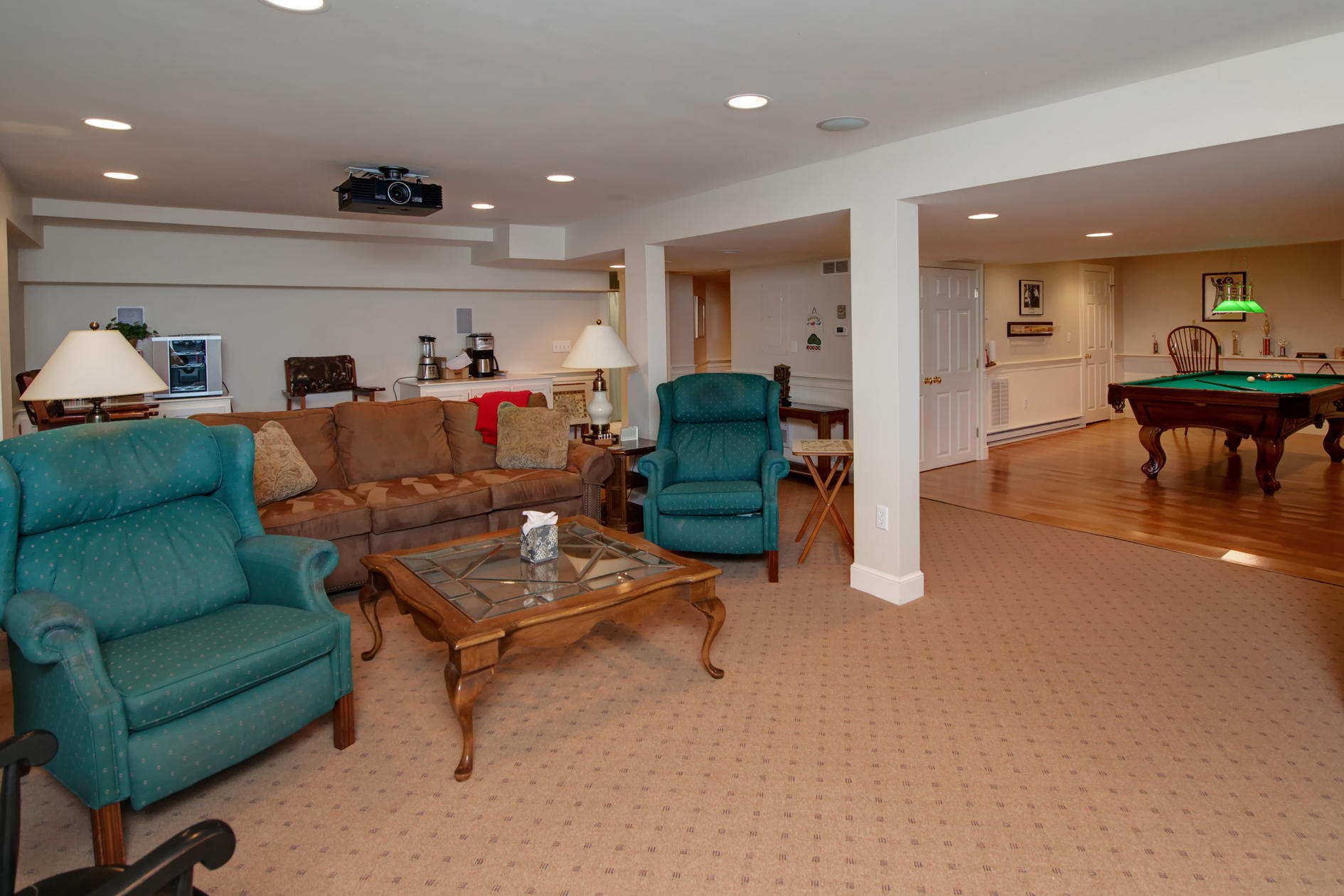 81 Farm Valley Road Osterville, MA 02655 - Photo 25 of 35 a living room with furniture and a dining table with kitchen view