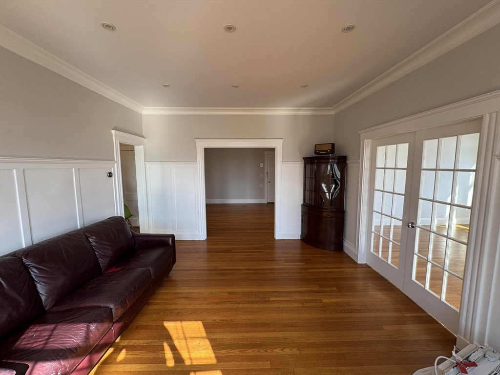 84 Tudor Street, Unit 6 Chelsea, MA 02150 - Photo 2 of 14 a living room with furniture and a rug