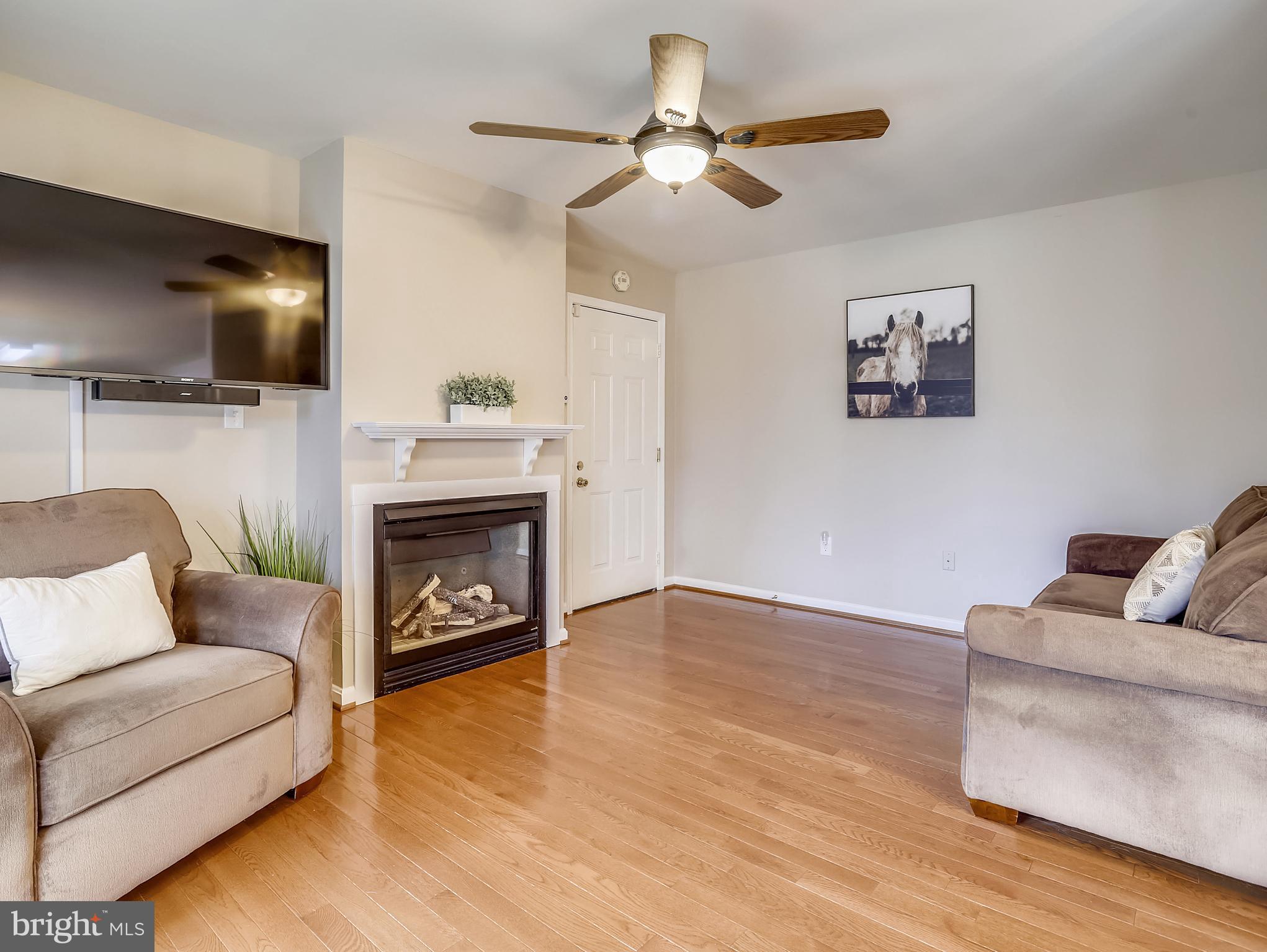 4823 Atwell Road Shady Side, MD 20764 - Photo 12 of 28 Den with fireplace off the kitchen.