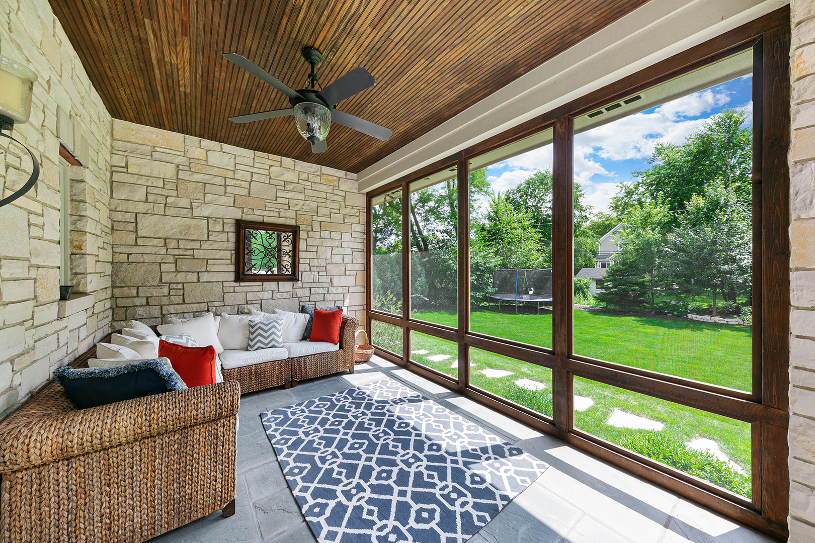 900 East Hillside Road Naperville, IL 60540 - Photo 21 of 73 a living room with furniture and a floor to ceiling window