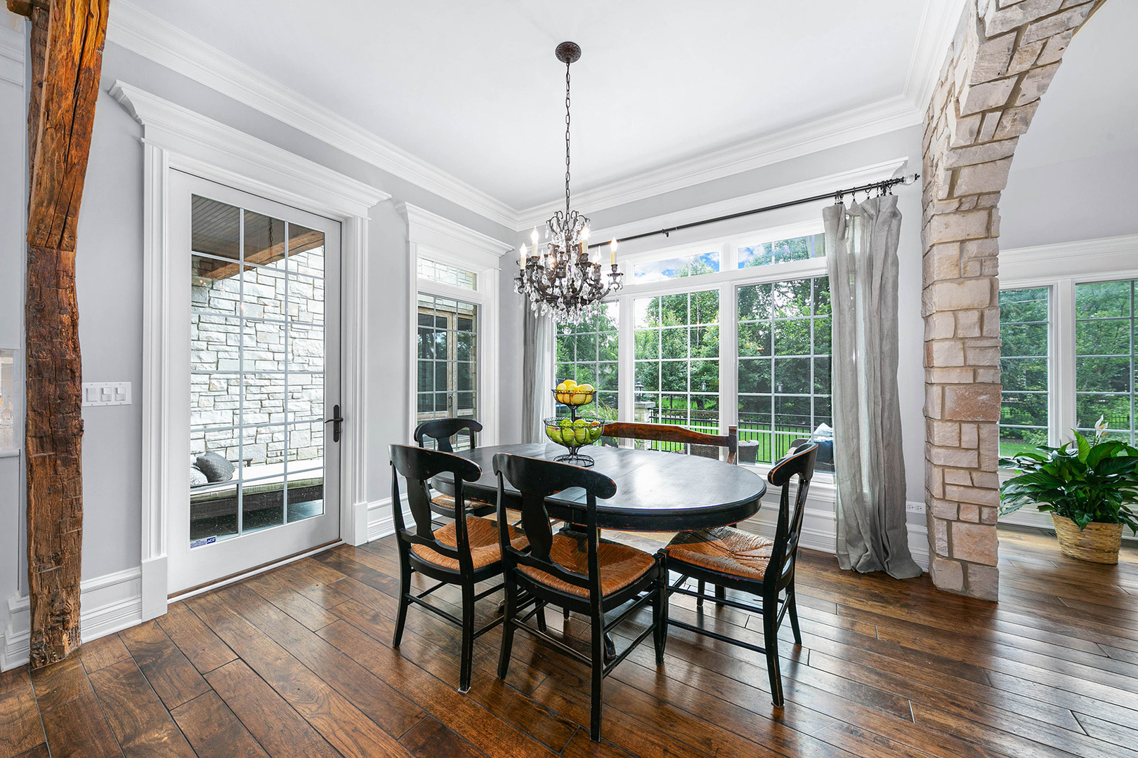 900 East Hillside Road Naperville, IL 60540 - Photo 22 of 73 a dining room with furniture window and wooden floor