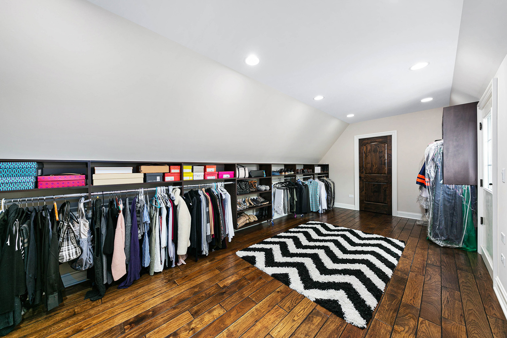 900 East Hillside Road Naperville, IL 60540 - Photo 38 of 73 a view of walk in closet with clothes