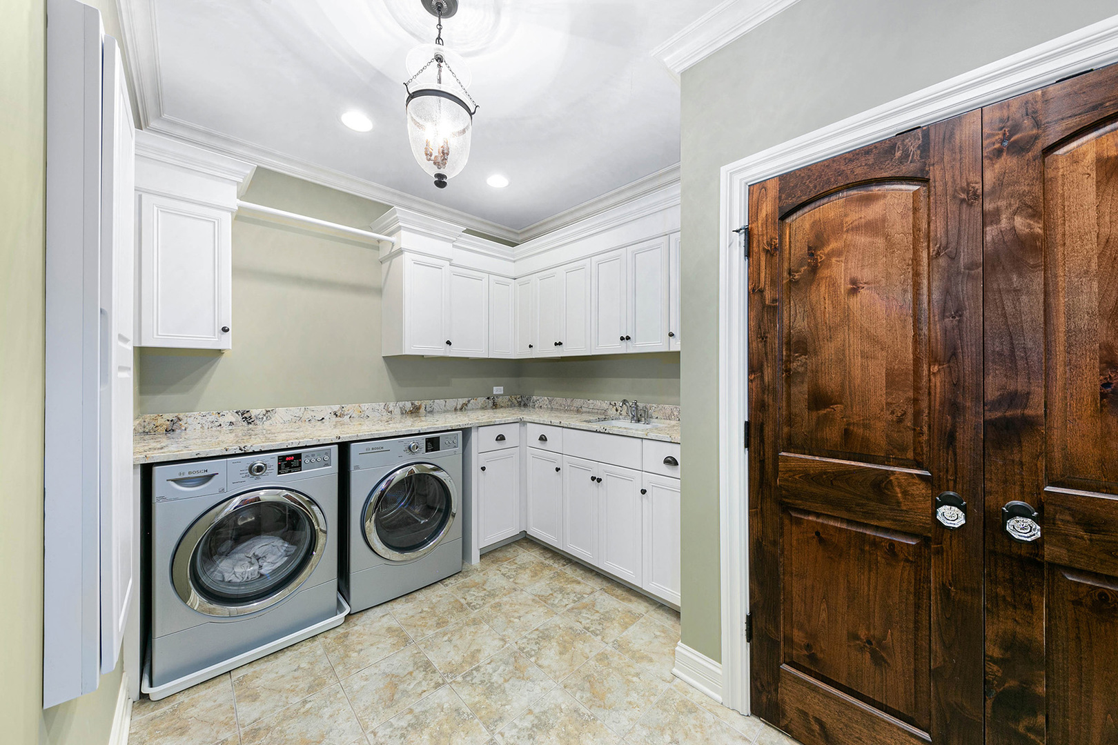 900 East Hillside Road Naperville, IL 60540 - Photo 51 of 73 a view of a storage and utility room with washer and dryer
