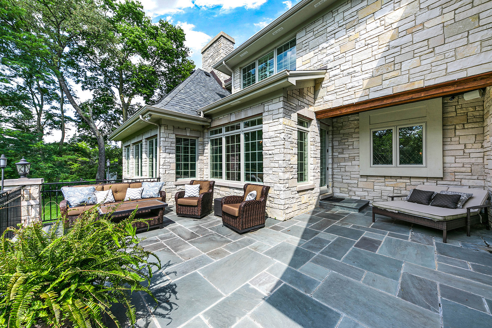900 East Hillside Road Naperville, IL 60540 - Photo 67 of 73 a view of a patio with couches chairs and potted plants