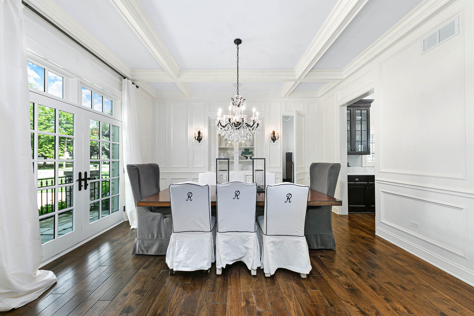 900 East Hillside Road Naperville, IL 60540 - Photo 9 of 73 a dining room with furniture a chandelier and wooden floor