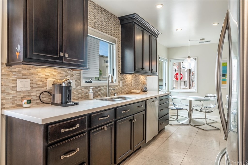 316 7th Street Manhattan Beach, CA 90266 - Photo 15 of 34 a kitchen with a sink cabinets and window