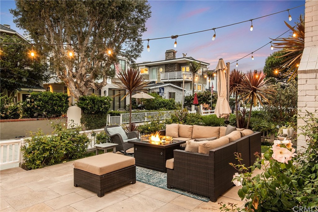 316 7th Street Manhattan Beach, CA 90266 - Photo 2 of 34 a view of a patio with couches and a fire pit
