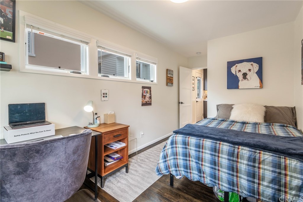 316 7th Street Manhattan Beach, CA 90266 - Photo 24 of 34 a bedroom with a bed and wooden floor