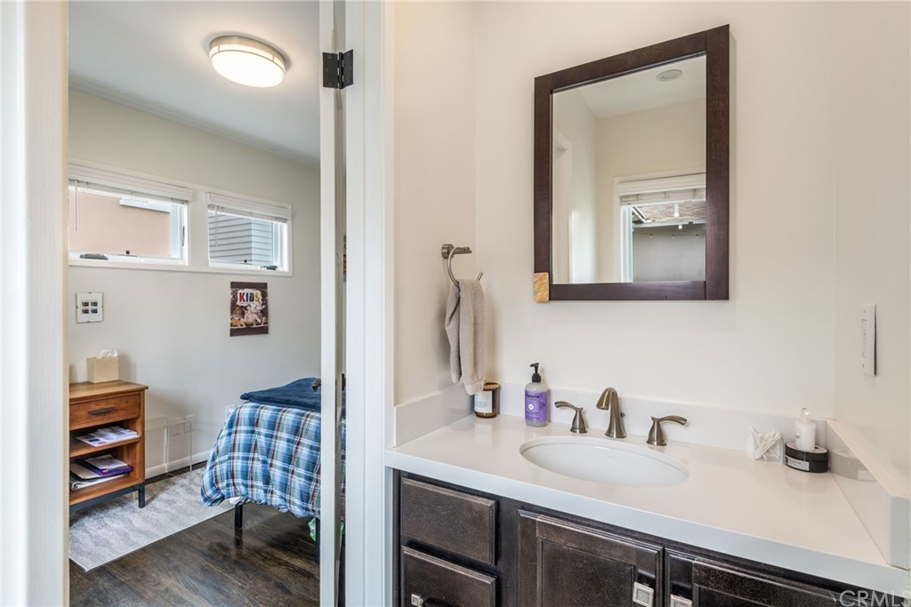 316 7th Street Manhattan Beach, CA 90266 - Photo 25 of 34 a bathroom with a sink and a mirror