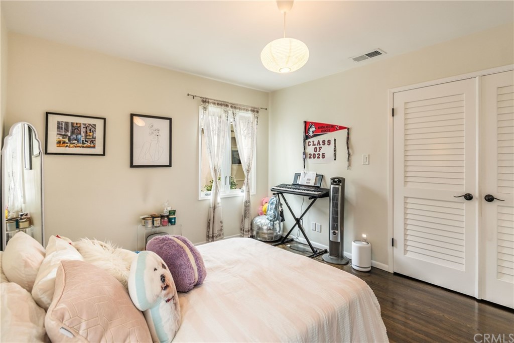 316 7th Street Manhattan Beach, CA 90266 - Photo 27 of 34 a bedroom with a bed and a painting on the wall