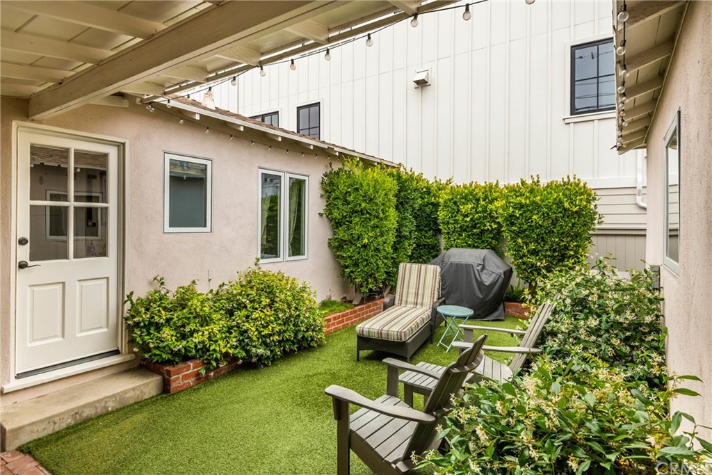 316 7th Street Manhattan Beach, CA 90266 - Photo 28 of 34 a backyard of a house with outdoor seating