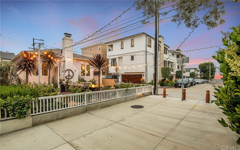 316 7th Street Manhattan Beach, CA 90266 - Photo 3 of 34 a view of a building with a bench in front