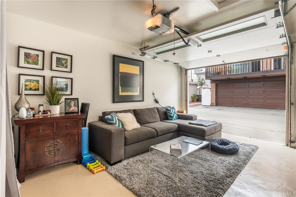 316 7th Street Manhattan Beach, CA 90266 - Photo 32 of 34 a living room with furniture and a rug