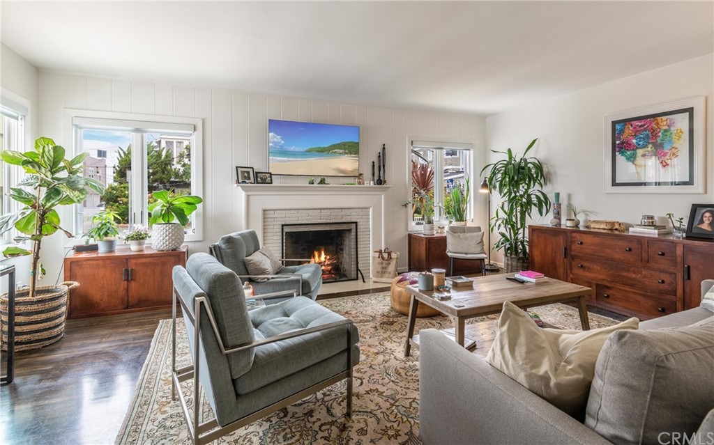 316 7th Street Manhattan Beach, CA 90266 - Photo 9 of 34 a living room with furniture fireplace and a potted plant