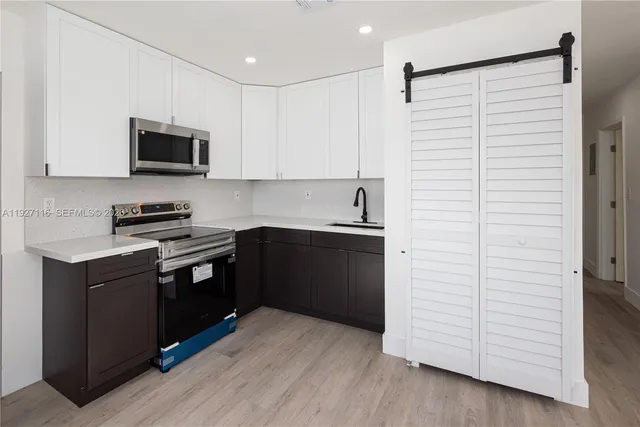 a kitchen with a sink and cabinets