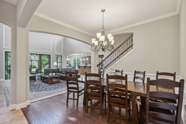 a spacious bedroom with a bed and a large window