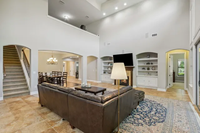a bathroom with a tub a sink and a mirror