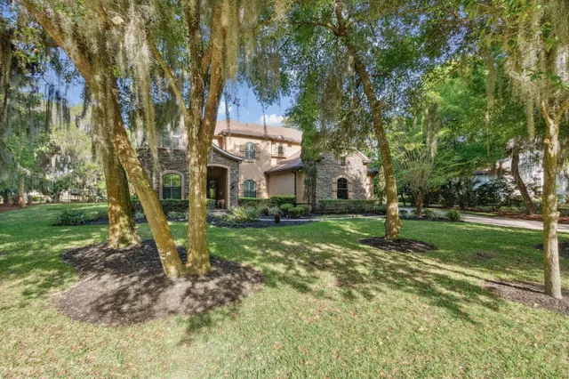 a garden with trees in the background
