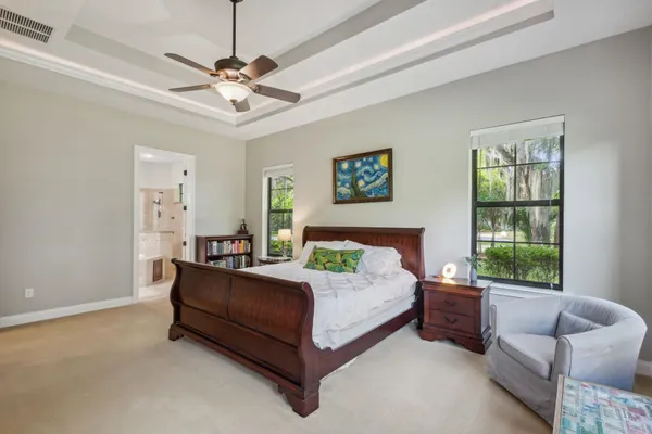 a bathroom with a sink a toilet and a window