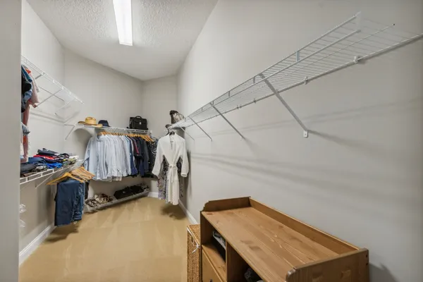 a bedroom with furniture and a window