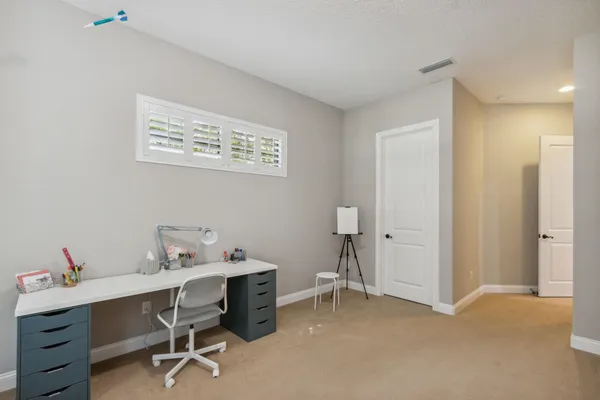 a living room with furniture ceiling fan
