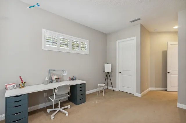 a living room with furniture ceiling fan
