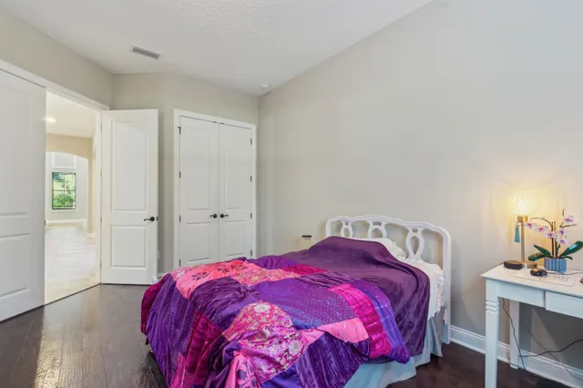 a dining room with furniture and a book shelf