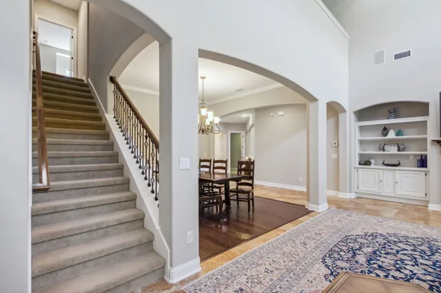 a room with a book shelf and a book shelf