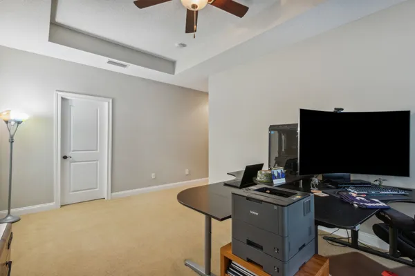 a view of a swimming pool with sitting area