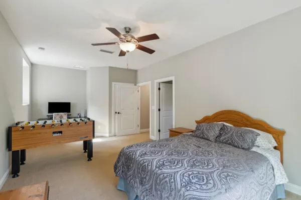a kitchen with granite countertop a refrigerator stove and sink