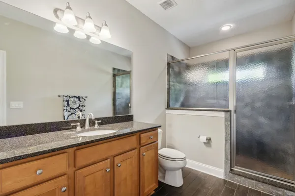 a view of a cars park in front of a house