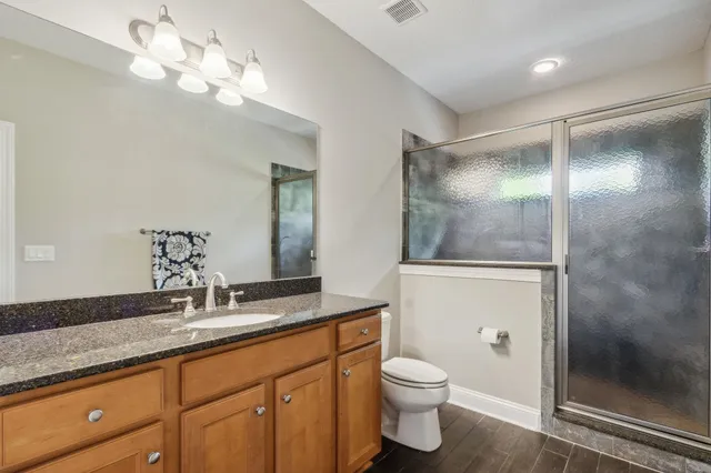 a view of a cars park in front of a house