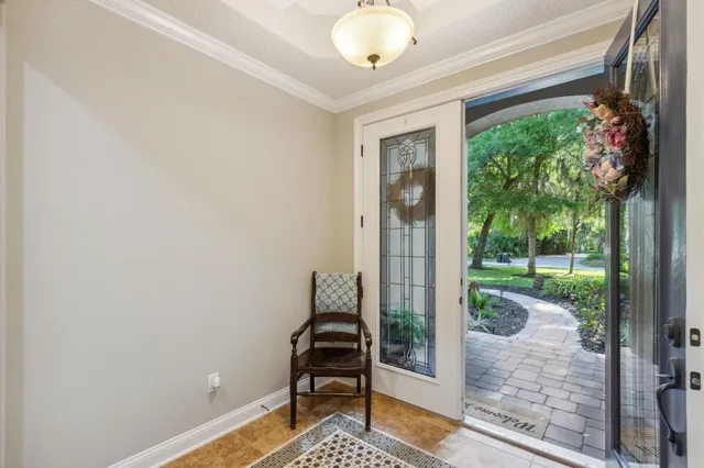 a living room with furniture large window and flat screen tv